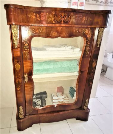 Small one-door cabinet.